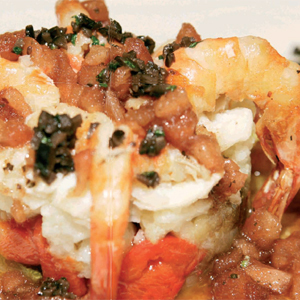 TIMBAL DE COLIFLOR SALTEADA CON BACALAO CONFITADO A BAJA TEMPERATURA Y VINAGRETA DE TOMATE
